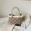 Bolso tipo cubo casual estilo coreano, nuevo bolso de mano otoño e invierno 2026, bolso de hombro y cruzado de moda con lunares único