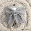 Venta al por mayor de fábrica Accesorios de Navidad Adornos forma tridimensional Adornos de pared Lazo Colgantes de árbol de Navidad Suministros de decoración