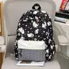 Mochila escolar para estudiantes de secundaria y preparatoria, ligera para el uso diario, mochila versátil, estilo de dibujos animados ins, mochila ligera de viaje para estudiantes universitarios