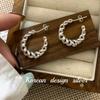 Joyería de Plata Coreana al por Mayor Dongdaemun Plata Esterlina S925 Aretes de Línea Torcida Calada Curva Diseño Nicho para Mujer