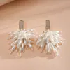 Pendientes de borla de flor de concha blanca transfronterizos europeos y americanos con perlas, pendientes de estilo de corte francés, pendientes ligeros y lujosos con un toque de alta gama