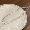 Colgante de plata con forma de corazón roto y cadena de clavícula con un toque de frescura, diseño de alta gama, estilo nicho 2023, nuevo collar de perlas explosivas para mujer.
