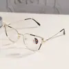 Armações de óculos estilo gatinho da moda, armações de óculos lisas da moda europeias e americanas, óculos fotocromáticos anti-luz azul de metal para comércio exterior transfronteiriço