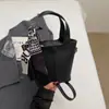 Bolsas Femininas de Nicho com Alto Aparato Moda Tendência Primavera 2026 Cesta Balde Bolsa de Ombro Transversal Texturizada