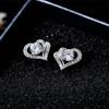 Pendientes pequeños y exquisitos de estilo japonés y coreano Cao Shi, elegantes pendientes de corazón a corazón que combinan con todo, pendientes de circonita simples en forma de corazón para mujer