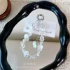 Cadena para colgar funda de teléfono de vidrio con cuentas de flor de borla, colgante de cristal exquisito, accesorio para bolso, adorno de cordón para llave de coche