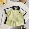 Conjunto de verano de manga corta para niños, ropa de verano nueva, POLO de bloques de color, elegante conjunto de dos piezas para niños y bebés, fresco y moderno