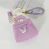 Colgante Creativo de Macarrón Regalo Cuerda Trenzada a Mano Bolsa para Llaves Dibujo Animado Sanrio Color Caramelo Billetera Pequeña al por Mayor