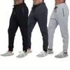 Pantalones largos casuales para hombre con diseño deportivo estilo americano, con bolsillos y cremallera, cintura elástica y corte ajustado - disponibles ahora