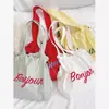 Bolso de Hombro Canvas Cultural y Creativo para Universidad Personalizado Nuevo Gran Capacidad Casual Versátil Cordón Estampado Bolso de Mano