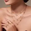 Conjunto de Joyería Versátil de Acero Inoxidable con Flor de Cuatro Hojas y Circonita, Aretes, Anillo, Chapado en Oro de 18K, Moda Europea y Americana