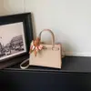 Bolso Kelly de patrón de cocodrilo transfronterizo para mujer, nuevo bolso cuadrado pequeño versátil de moda primavera-verano 2026 para hombro y cruzado