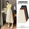 Moda maternidade outono e inverno novo estilo fivela de nariz de porco cordão saia curta suporte para barriga cós largo drapeado saia evasê cobrir a barriga emagrecimento