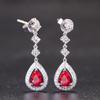 Aretes colgantes de temperamento de moda europea y americana con gema de corindón rojo en forma de gota, color tesoro, cobre chapado en platino, aretes, aretes, joyería al por mayor