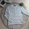 Suéter de punto con cuello Henley, jersey de manga larga a rayas hueco para hombre, estilo fino de otoño e invierno, venta al por mayor de fábrica transfronteriza
