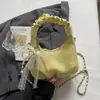 Bolso bandolera mujer 2026 nuevo diseño de nicho cadena plisado bolsa de albóndiga trabajo pequeño para llevar a todas partes bolso de hombro