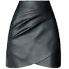 Minifalda plisada de cuero talla grande para mujer, nueva falda irregular de línea A de cintura alta adelgazante para otoño e invierno, falda corta ajustada a la moda