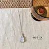 Nuevo Estilo Chino Espejo Reflectante Calcedonia Natural Hebilla de Seguridad Collar Pendientes Oro Rubí Colgante Elegante Collar de Gama Alta