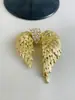 Europeo y americano nuevo retro Vintage alas pedrería elegante traje abrigo broche diseño de nicho sentido corsage moda