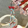 Princesa suelta moño rojo plano cadena de frutas para teléfono móvil contraste rojo y azul cadena colgante de cuentas diy cadena colgante para cámara ccd