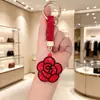 Bestseller transfronterizo creativo colgante llavero rosa incrustado de diamantes accesorio de bolso flor de strass de cuero regalo decoración