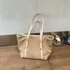 Comercio exterior, estilo relajado, vintage, bolso tote de gran capacidad para mujer, colección de otoño, lujo ligero, diseño de nicho, versátil, adecuado para ir al trabajo, bolso de hombro, y se puede llevar bajo el brazo