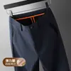 Pantalones casuales elásticos de exportación de comercio exterior para hombre, nuevos pantalones de traje de negocios rectos de ajuste holgado para hombre de mediana edad para otoño e invierno 2026