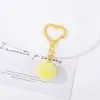 Llavero de corazón con pompón de colores, hebilla creativa de corazón hueco de dopamina, accesorio para bolso, adorno de regalo, colgante de cuentas
