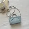 Bolso de Mano de Mezclilla Simple Casual Estilo Coreano para el Trabajo y los Viajes Diarios, Nuevo Bolso Cruzado Versátil Tipo Dumpling para Mujer 2026