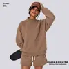 Conjunto de ropa europea y americana para mujer transfronterizo: sudadera casual y shorts, sudadera holgada de forro polar color liso, cuello medio alto, estilo 'dopamine hot girl'