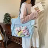 Bolsa Casual de Grande Capacidade para Mulheres 2026 Novo Estilo Versátil Bolsa de Ombro de Lona para o Trabalho Estudante Universitário Bolsa de Aula Bolsa Tote