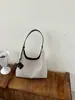 Bolso tote de gran capacidad para mujer, nueva versión coreana 2026, bolso de hombro versátil de moda de alta gama para el trabajo, retro, moderno
