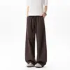 Pantalones negros de corte inclinado y curvos para hombre, nuevo estilo de verano, marca de moda, pantalones deportivos holgados rectos de pierna ancha