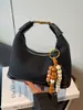 Bolsas Femininas Exclusivas e Modernas de Nicho Outono e Inverno 2025 Nova Moda Versátil Bolsa de Ombro Transversal Bolsa de Mão Bolsa de Bolinho