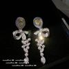 Pendientes de piedras preciosas con pétalos amarillos del Crepúsculo de Cenicienta, pendientes con forma de pera de montaña Zhu, pendientes con lazo de gota de agua amarilla de ganso en oro de 18 quilates.