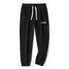 Calças masculinas de veludo cotelê para primavera e outono, calças esportivas, calças de moletom masculinas, folgadas e versáteis, calças casuais com retalhos, calças jogger, calças compridas
