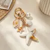 Nuevo llavero creativo y personalizado de playa con conchas, caracoles marinos y estrellas de mar, adecuado para regalos de coche, colgantes de bolso y decoraciones