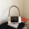Bolsa baguette de nicho super popular para outono e inverno, novo estilo 2026 para mulheres, bolsa de ombro única/sob o braço da moda para o trabalho, bolsa de mão para atividades ao ar livre