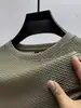 Camiseta de verano fina de seda helada de manga corta para hombre, corte holgado, patrón de gofres, manga media, cuello redondo, top de moda estilo Ins, disponible para venta al por mayor
