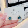Aretes de Cristal Azul con Acabado de Alta Gama, Estilo de Celebridad de Internet, Versátiles Aretes de Botón con Aguja de Plata, Aretes de Temperamento Femenino, 2021 Nuevo Diseño Versátil de Moda Tendencia