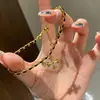 Pulseira explosiva antiga de cruz de ouro negro 2025 nova luxo leve nicho moda alto senso joia trançada
