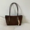 Nueva colección de primavera 2026: Bolso de mano para mujer estilo coreano, con un elegante diseño color block, gran capacidad y correa para el hombro, lo que lo convierte en un bolso tote versátil para ventas transfronterizas.