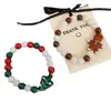 Transfronterizo europeo y americano nuevo estilo navideño dulce lindo combinable esmalte de imitación muñeco de nieve hombrecillo de azúcar pulsera de cuentas roja verde