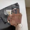 Bolso tipo cubo de alta gama estilo coreano para mujer 2026 Modelo Nuevo Bolso de mano simple y elegante Bolso bandolera cruzado de hombro moderno para ropa casual de trabajo