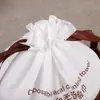 Em estoque rolo de toalha de limpeza toalha bolsa com cordão bolsa de embalagem de toalha facial descartável bolsa com cordão transparente fosca portátil