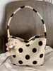 Bolso de mujer de moda de lunares de nicho estilo coreano 2026 nuevo bolso de hombro para el verano bolso de cubo pequeño elegante