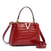Bolso de mano de cuero brillante con estampado de piedras, estilo estéreo, popular en Internet, moderno, tipo bandolera, tipo cubo en forma de V.