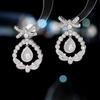 Brincos de estilo de corte de moda de luxo de luxo leve com design Zircon s925 Brincos de arco de flor de agulha de prata