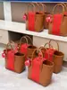 2025 Xiaohongshu Nuevo Regalo Souvenir Flor Roja de Boda Cesta Tejida Bolsa de Regalo para Dama de Honor Cesta Tejida Bolso de Mujer