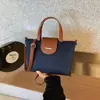 Bolsa Casual Grande Capacidade para Mulheres 2025 Novo Estilo Coreano Cor Contrastante Bolsa de Ombro Transversal Bolsa de Mão Tote Simples para Roupa de Trabalho